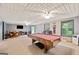 Spacious game room featuring a pool table, dining table, and access to the outdoors at 160 Country Mill Ln, Stockbridge, GA 30281