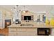 Kitchen island featuring granite countertops, stainless steel sink, and a breakfast bar area at 160 Country Mill Ln, Stockbridge, GA 30281