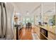 Cozy kitchen with stainless steel appliances, hardwood floors, and a breakfast nook area at 160 Country Mill Ln, Stockbridge, GA 30281