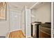 Well-lit laundry room features a washer, dryer, and an access door at 160 Country Mill Ln, Stockbridge, GA 30281