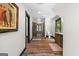 Bathroom featuring a shower, toilet, window, hardwood floors and a wooden vanity at 193 Stonegate Trl, Carrollton, GA 30116