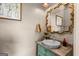 Elegant powder room features a decorative mirror and stylish vanity at 193 Stonegate Trl, Carrollton, GA 30116