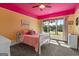 Bright bedroom with light colored walls, carpet, and a pink ceiling and charming decor at 193 Stonegate Trl, Carrollton, GA 30116