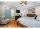 Spacious bedroom with a blue barn door leading to an ensuite bathroom at 193 Stonegate Trl, Carrollton, GA 30116