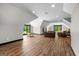 Expansive bonus room with hardwood floors, large windows, and ample space for living and entertaining at 193 Stonegate Trl, Carrollton, GA 30116