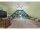 Spacious bonus room with blue shelving, a ceiling fan, and carpet at 193 Stonegate Trl, Carrollton, GA 30116