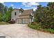 Beautiful exterior of a home with a two-car garage and well maintained landscaping at 193 Stonegate Trl, Carrollton, GA 30116
