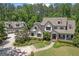 Beautiful two-story home with a charming front porch, mature landscaping, and a separate garage building at 193 Stonegate Trl, Carrollton, GA 30116