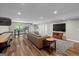 Finished basement with game room features shuffleboard table, kitchenette, and seating at 193 Stonegate Trl, Carrollton, GA 30116