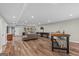 Finished basement with a game room that features a shuffleboard table, kitchenette and seating at 193 Stonegate Trl, Carrollton, GA 30116