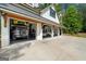 Well-equipped four-car garage with modern amenities, car lifts and ample space for vehicle storage and maintenance at 193 Stonegate Trl, Carrollton, GA 30116