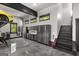 Well-organized garage featuring custom cabinets, an epoxy floor, and access to a staircase at 193 Stonegate Trl, Carrollton, GA 30116