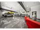 Spacious garage features car lift, modern cabinets, and a polished floor with room for a seating area at 193 Stonegate Trl, Carrollton, GA 30116