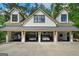 Impressive four-car garage showcasing a well-organized interior with vehicles and a sleek design at 193 Stonegate Trl, Carrollton, GA 30116