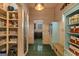 Hallway with pantry and view of the kitchen and green tile at 193 Stonegate Trl, Carrollton, GA 30116