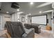 Enjoy this cozy home theater with reclining seats and a large screen for movie nights at 193 Stonegate Trl, Carrollton, GA 30116