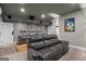 Relax in this home theater with movie poster decor, large screen and reclining chairs at 193 Stonegate Trl, Carrollton, GA 30116