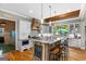 Well-lit kitchen features wood accents, bar seating, and modern appliances at 193 Stonegate Trl, Carrollton, GA 30116