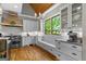 Beautiful kitchen with a custom vent hood and window seating area at 193 Stonegate Trl, Carrollton, GA 30116