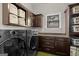 Functional laundry room with ample cabinet and counter space at 193 Stonegate Trl, Carrollton, GA 30116