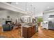 Open-concept: Kitchen island, living room, and hardwood flooring at 193 Stonegate Trl, Carrollton, GA 30116