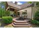 Enjoy outdoor dining on the wooden patio with a table and chairs at 193 Stonegate Trl, Carrollton, GA 30116