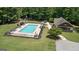 Community pool and pool house with playground and outdoor seating area, perfect for entertaining and relaxation at 193 Stonegate Trl, Carrollton, GA 30116