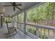 Spacious porch has rocking chair and swing, perfect for outdoor relaxing at 392 Hightower Ridge Rd, Covington, GA 30014