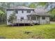 The home boasts a wooden deck and a spacious backyard at 392 Hightower Ridge Rd, Covington, GA 30014
