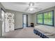 Cozy bedroom features a ceiling fan and a window offering ample natural light at 392 Hightower Ridge Rd, Covington, GA 30014