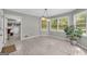 Sunlit breakfast nook with three windows and view to laundry room at 392 Hightower Ridge Rd, Covington, GA 30014