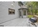 A spacious deck includes a grill, perfect for outdoor entertaining and enjoying the natural surroundings at 392 Hightower Ridge Rd, Covington, GA 30014