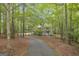 Secluded home surrounded by lush trees, accessed by a long, private driveway at 392 Hightower Ridge Rd, Covington, GA 30014