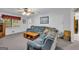 Cozy living room featuring a large gray sectional sofa and bright natural light at 392 Hightower Ridge Rd, Covington, GA 30014