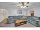 Comfortable living room featuring an oversized gray sectional sofa and classic decor at 392 Hightower Ridge Rd, Covington, GA 30014
