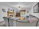 Bright living room features a fireplace, ceiling fan, and comfortable seating area at 392 Hightower Ridge Rd, Covington, GA 30014