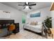 Comfortable bedroom with natural light, desk, and a cozy daybed at 111 Rosignol Dr, Sharpsburg, GA 30277