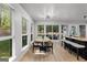 Sunlit dining area with views of the backyard and access to the kitchen at 111 Rosignol Dr, Sharpsburg, GA 30277