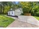 Spacious two-car garage with extended driveway and manicured lawn at 111 Rosignol Dr, Sharpsburg, GA 30277
