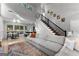 Bright living area with high ceilings, hardwood floors, and a staircase at 111 Rosignol Dr, Sharpsburg, GA 30277