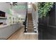 Open-concept living space with high ceilings, staircase, and abundant natural light at 111 Rosignol Dr, Sharpsburg, GA 30277