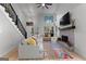 Comfortable living room featuring a fireplace, high ceilings, and an open floor plan at 111 Rosignol Dr, Sharpsburg, GA 30277