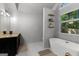 Spacious main bathroom features a soaking tub, shower, and a dark wood vanity at 111 Rosignol Dr, Sharpsburg, GA 30277
