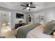 Bright main bedroom featuring light wood floors and open doorway to the ensuite bath at 111 Rosignol Dr, Sharpsburg, GA 30277
