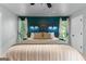 Spacious main bedroom features natural light and an accent wall with unique headboard at 111 Rosignol Dr, Sharpsburg, GA 30277