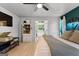 Bright main bedroom features light wood floors and an open doorway to the ensuite bath at 111 Rosignol Dr, Sharpsburg, GA 30277