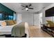 Comfortable main bedroom with a king bed, ceiling fan, and ensuite bathroom access at 111 Rosignol Dr, Sharpsburg, GA 30277