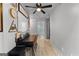 Functional home office area with dark desk, light wood flooring, and crisp white walls at 111 Rosignol Dr, Sharpsburg, GA 30277