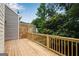 Wooden back deck offers a relaxing outdoor space with views of the natural backyard at 1368 Poplar Se Pointe, Smyrna, GA 30082