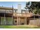 View of a backyard featuring tiered wooden decks and a small grass lawn at 1368 Poplar Se Pointe, Smyrna, GA 30082